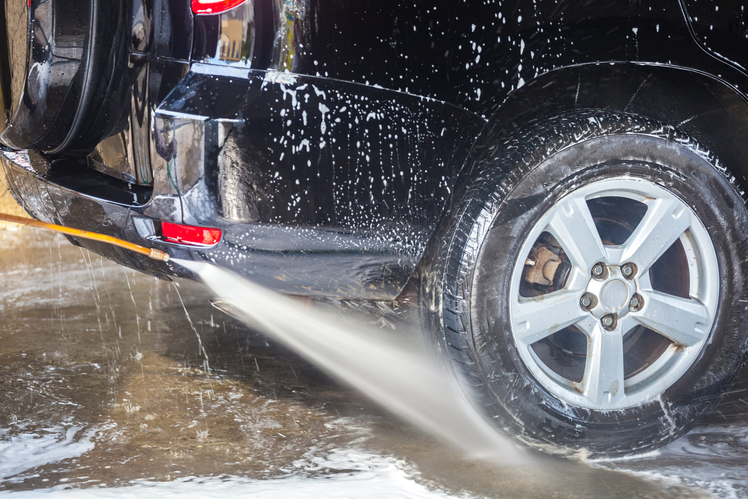 Cleaning Car With High Pressure Water And Foam